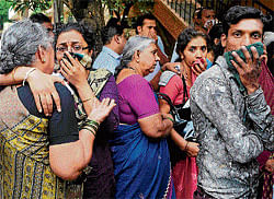 inconsolable: Relatives and neighbours mourn at the slain couples residence at JP Nagar on Friday.  dh photo
