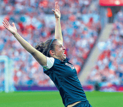 exultant American midfielder Carli Lloyd celebrates after scoring against Japan. AP