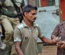 Siladitya Chowdhury, a farmer, being produced in a court in Jhargram in West Midnapore district on Saturday. PTI