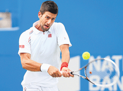 in command Serbias Novak Djokovic returns during his win over Americas Sam&#8200;Querrey in the Toronto Masters on Friday. AFP