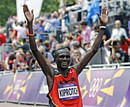 Stephen Kiprotich of Uganda celebrates after winning the men's marathon at the 2012 Summer Olympics in London, Sunday, Aug. 12, 2012. AP