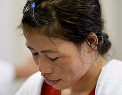 A disappointed MC Mary Kom after losing to Nicola Adams of Great Britain in the semi-final of women's Flyweight boxing at Olympic Games in London on Wednesday. PTI Photo
