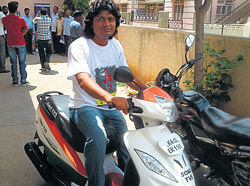 Samarth Shenoy on his scooter.