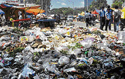 Dirty picture: Garbage disposal in the City has become a messy affair. DH photo