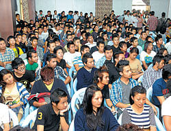 keen North-Eastern students at St Josephs College listening to the officials.  dh photos by dinesh s k