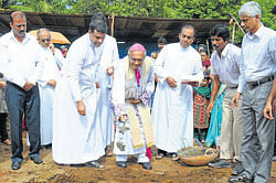 Mangalore diocesean Bishop Rev Dr Aloysius Paul D'Souza laying the foundation for the project of constructing 28 houses at Mariashram church in Talapady.