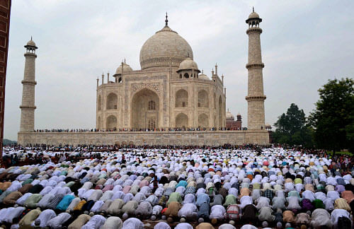 Agra : Muslims offering Eid-ul-Fitr prayers at the historic Taj Mahal in Agra on Monday. PTI Photo