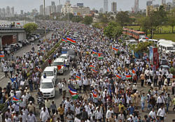 Activists from the Maharashtra Navnirman Sena (MNS) walk down Marine Drive during a protest rally in Mumbai August 21, 2012. Thousands of activists held the rally to protest against a violent riot that took place in Mumbai on August 11 and against the illegal immigration of Bangladeshis into India, local media reported on Tuesday. REUTERS/Vivek Prakash