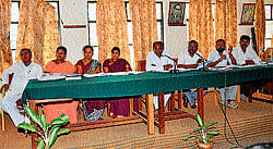 MLA C Puttaranga Shetty addresses progress review meeting of trimester at Chamarajanagar on Thursday. President Mahadevi, vice president P Mahalingaswamy, R Kaveri, G Nagashree and B P Puttabuddi are seen. dh photo