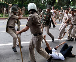 New Delhi: Police detain India Against Corruption activist, while he was moving towards the PM residence, during a protest march on coal block allocation issue in New Delhi on Sunday. PTI Photo by Shahbaz Khan