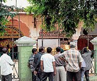 dumbstruck: Curious passers-by look at the Lansdowne Building in Mysore on Sunday. dh photos