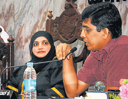 MCC Commissioner Harish Kumar speaks at the MCC monthly meet held in Mangalore  on Monday. Mayor Gulzar Banu look on.
