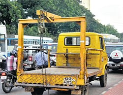 uncommon Towing vehicles will soon be a rare sight in the City. DH Photo by Janardhan B K