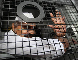 Gangster-turned-politician Arun Gawli is taken to jail in a police vehicle after he was sentenced to life term in the murder case of Shiv Sena corporator Kamlakar Jamsandekar in Mumbai on Friday. PTI Photo