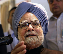 Prime Minister Manmohan Singh addressing the media on Friday onboard his special flight to Delhi after attending the XVI NAM Summit in Tehran. PTI