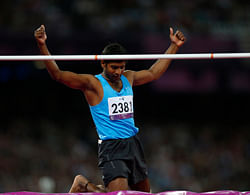 Silver medalist India's Girisha Hosanagara Nagarajegowda reacts after clearing the bar in the men's high jump F42 classification final during the athletics competition at the 2012 Paralympics, Monday, Sept. 3, 2012, in London. AP