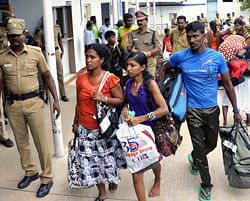 Indian policemen escort Sri Lankan pilgrims, foreground center after they were mobbed by locals in Thanjavur district, Tamil Nadu state, India. Around 175 Sri Lankan pilgrims were mobbed Monday in Tamil Nadu and had to seek refuge in the church they were visiting. Tamil Nadu is home to some 60 million Tamils who have ancestral links with Sri Lanka's ethnic minority Tamils. The Indian Tamils have often expressed anger against Sri Lanka's Sinhalese-dominated government, which has been accused of abusing Tamils during the country's civil war.AP