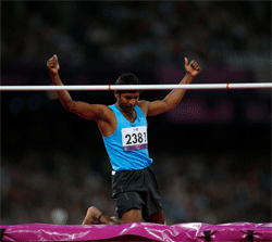 Silver medalist India's Girisha Hosanagara Nagarajegowda reacts after clearing the bar in the men's high jump F42 classification final during the athletics competition at the 2012 Paralympics, Monday, Sept. 3, 2012, in London. (AP Photo