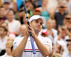 Andy Roddick of the United States waves to the crowd after losing to Juan Martin Del Potro of Argentina after their men's singles fourth round match on Day Ten of the 2012 US Open . AFP