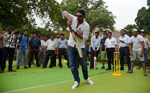 Indian cricketer and cancer survivor Yuvraj Singh bats during a YouWeCan event for the Yuvraj Singh Cancer Foundation in New Delhi. AFP