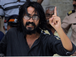 Kanpur-based cartoonist Aseem Trivedi arrested on charges of posting seditious contents on his website being produced at court in Mumbai on Sunday. PTI Photo