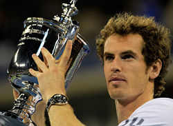 Andy Murray of Great Britain kisses the US Open championship trophy after defeating Novak Djokovic of Serbia in the men's singles final match on Day Fifteen of the 2012 U.S. Open at the USTA Billie Jean King National Tennis Center on September 10, 2012 in the Flushing neighborhood, of the Queens borough of New York City. AFP