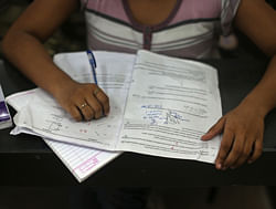 A student studies in a classroom at the Bansal Classes in Kota in India's desert state of Rajasthan August 13, 2012. With a sprawling five-acre campus, 10,000 students and state-of-the-art LCD projectors in its lecture rooms, Bansal Classes is bigger and slicker than most schools in India. Reuters