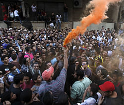 People shout slogans and light flares in front of the U.S. embassy during a protest against what they said was a film being produced in the United States that was insulting to the Prophet Mohammad, in Cairo September 11, 2012. Egyptian protesters scaled the walls of the U.S. embassy in Cairo on Tuesday and some pulled down the American flag during the protest, witnesses said. REUTERS