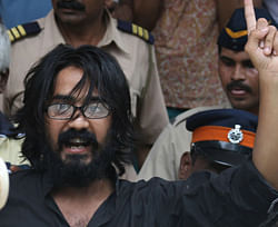 Indian cartoonist Aseem Trivedi gestures outside a court in Mumbai. Indian cartoonist Aseem Trivedi detained on sedition charges is expected to accept bail terms and leave prison on September 12, 2012, his lawyer said, in a case that has outraged freedom of expression campaigners. AFP