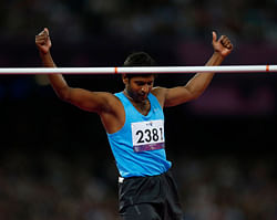 Silver medalist India's Girisha Hosanagara Nagarajegowda reacts after clearing the bar in the men's high jump F42 classification final during the athletics competition at the 2012 Paralympics, Monday, Sept. 3, 2012, in London. AP