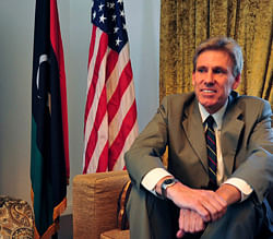 Christopher Stevens, the U.S. ambassador to Libya, smiles at his home in Tripoli June 28, 2012. Stevens and three embassy staff were killed late on September 11, 2012, as they rushed away from a consulate building in Benghazi, stormed by al Qaeda-linked gunmen blaming America for a film that they said insulted the Prophet Mohammad. Stevens was trying to leave the consulate building for a safer location as part of an evacuation when gunmen launched an intense attack, apparently forcing security personnel to withdraw. Picture taken June 28, 2012. REUTERS
