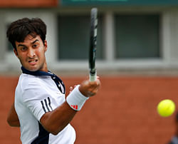 India's Yuki Bhambri returns a shot to New Zealand's Daniel King-Turner, unseen, during their Davis Cup tennis match in Chandigarh, India, Friday, Sept. 14, 2012. AP