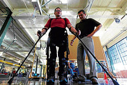Back on track: Matt Tilford using robotic legs, called an exoskeleton by Ekso Bionics, with a physical therapist, Craig Newsam. NYT
