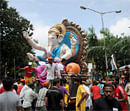 Indian Hindus pull a huge idol of the elephant-headed Hindu god Lord Ganesha through the streets of Mumbai. AFP Photo