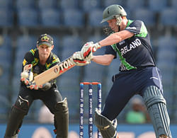 Ireland's Kevin O'Brien hits out watched by Australia's Matthew Wade (L) during the ICC World Twenty20 group B match at the R. Premadasa Stadium, Colombo September 19, 2012. REUTERS