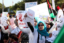 Demonstrators chant slogans while carrying banners, one of which reads, 'Stop, everything but the prophet', in a reference to the anti-Islamic movie produced in the U.S., during a protest against the movie in a main square in Benghazi city September 21, 2012. REUTERS