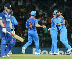 Indian cricketer Harbhajan Singh (R) celebrates after he dismissed England's cricketer Eoin Morgan (L) during the ICC Twenty20 Cricket World Cup match between Indian and England at the R. Premadasa Stadium in Colombo on September 23, 2012. AFP PHOTO