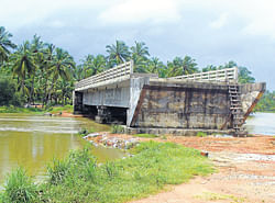 long wait to bridge gap: The  work on a bridge at Bennekudru in Barkur near Beahmavar is incomplete .