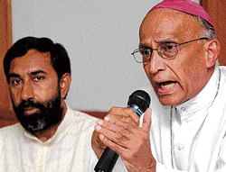 Archbishop Bernard Moras addresses the media at his residence in Bangalore on Monday  regarding the governments move to take back the land given to Sumanahalli Society. The  Societys director Fr George Kannanthanam is with him. dh Photo
