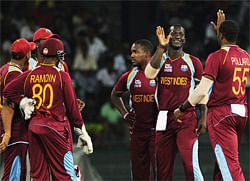 West Indies cricketer Darren Sammy (2R) celebrates after he dismissed Ireland cricketer Paul Stirling (unseen) during the ICC Twenty20 Cricket World Cup match between West Indies and Ireland at the R. Premadasa Stadium in Colombo on September 24, 2012. West Indies captain Darren Sammy won the toss and sent Ireland in to bat in their crucial Group B match at the World Twenty20 in Colombo. AFP
