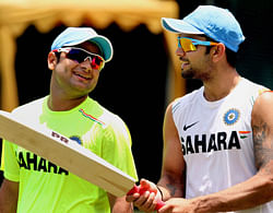 Indian cricketers Piyush Chawla and Virat Kohli during a practice session in Colombo on Tuesday. PTI