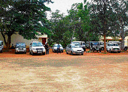 waiting: Government vehicles parked on the premises of the Zilla Panchayat in Chikkaballapur. dh photo