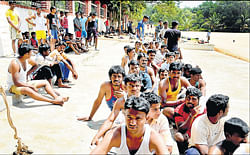 Wait for turn: Candidates wait for their turn to participate in the physical tests for selection to the KSRP constables post at the City Armed Reserve Police grounds in Mysore on Wednesday. DH&#8200;photo