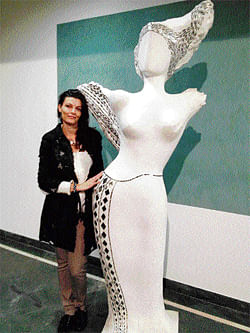 ARTIST Simona Bocchi with her sculpture Divine Entity.