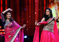 Actors Madhuri Dixit Nene (L) and Sridevi perform during a TV dance reality show in Mumbai on Tuesday. PTI