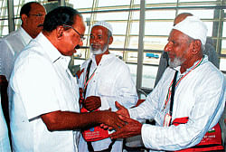 Union Minister M Veerappa Moily greeting Haj pilgrims moments before they boarded the flight to Mecca, at Mangalore airport on Sunday. A total of 219 pilgrims travelled on Sunday. DH photo