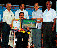 proud moment: Dr Krishna Mohan Prabhu of Prabhu General Hospital (Moodbidri) receiving S A Hussain Memorial Environment Award in Karkala on Sunday.