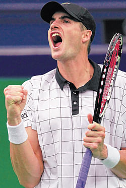 John Isner celebrates after defeating Kevin Anderson on Tuesday. REUTERS