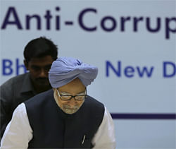 Indian Prime Minister Manmohan Singh prepares to sit at the annual conference of the Central Bureau of Investigation (CBI) and the state anti corruption bureaus in New Delhi, India , Wednesday, Oct. 10, 2012. (AP Photo/ Manish Swarup)