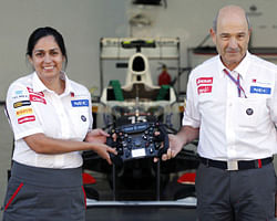 Monisha Kaltenborn (L), the new principal for the Sauber Formula One team, and outgoing team principal Peter Sauber pose at the team's garage during an announcement ceremony ahead of the South Korean F1 Grand Prix at the Korea International Circuit in Yeongam October 11, 2012. Indian-born Kaltenborn became the F1's first female team principal on Thursday after taking the helm at Sauber from founder Sauber with immediate effect. REUTERS